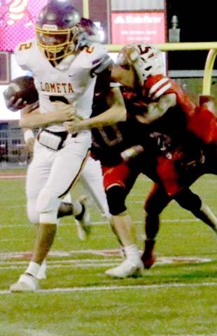 Lometa senior Enrique Prado battles for yards during his two-touchdown performance against the Leakey Eagles in Friday’s bi-district playoff loss. MEGAN LUSTY PHOTOGRAPHY | COURTESY PHOTO