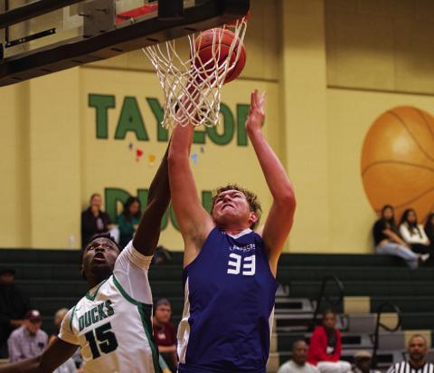 HUNTER KING | DISPATCH RECORD Beau Patterson goes up against a Taylor defender during last Friday’s game.