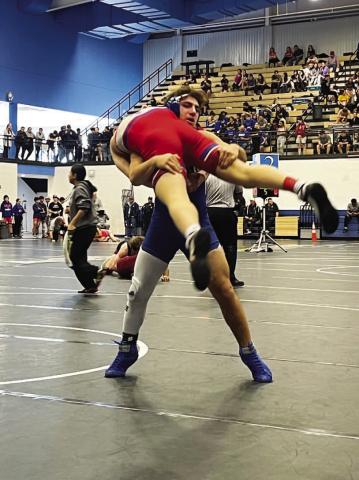 Daemian Rivas picks up his opponent during a match last week. COURTESY PHOTO