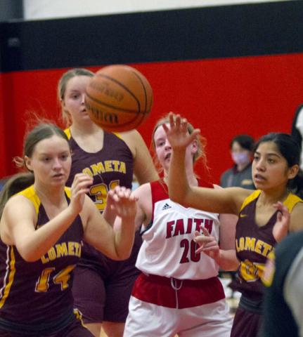 Shyanne Tower (14), Sierra Tower (31) and Emily Andrade (far right) go for a defensive rebound in a 63-20 victory at Marble Falls Faith Academy. JEFF LOWE | DISPATCH RECORD