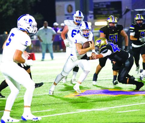 Reed Jerome runs through an attempted tackle against Marble Falls last Friday night. HUNTER KING | DISPATCH RECORD