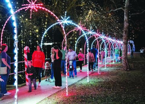 Christmas on the Creek attendees enjoy the lights along Candy Cane Lane. Vision Lampasas co-director Libby Bluntzer tells the Dispatch Record more than 500 people came to the W.M. Brook Park event a year ago. FILE PHOTO