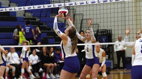 Ava Dowdy sets for a kill during the match against Lago Vista. HUNTER KING | DISPATCH RECORD