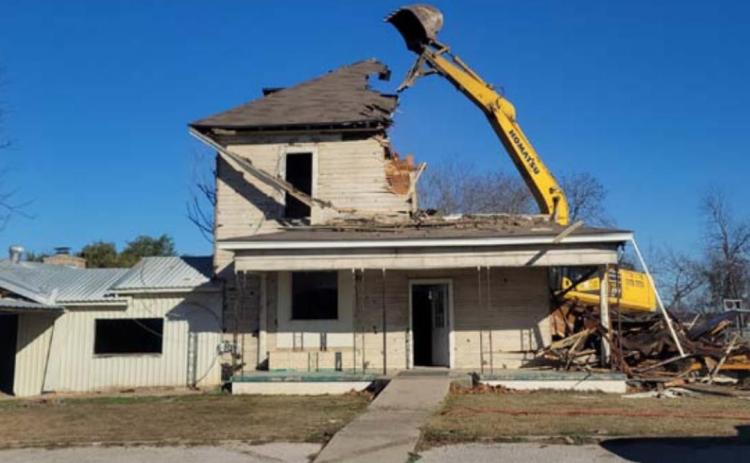 A Liberty Hill firm began work Monday to clear this house from Lometa ISD property. School officials are weighing how to use the available space once the structure is removed. MASON HINES | DISPATCH RECORD