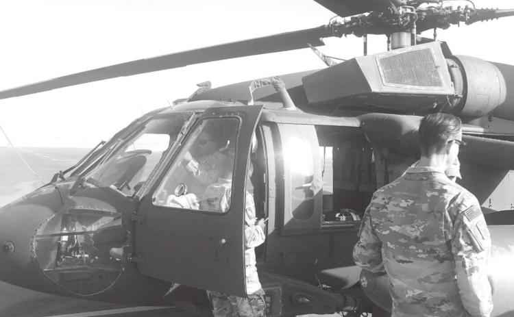 A Blackhawk helicopter is shown here. Flags flown from a military helicopter over Kuwait have been donated to Hanna Springs Elementary School. COURTESY PHOTO