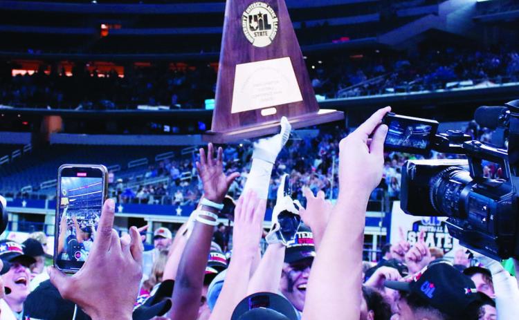 China Spring players hoist the State Champion trophy high, following their 24-21 comeback victory over Boerne. MASON HINES | DISPATCH RECORD