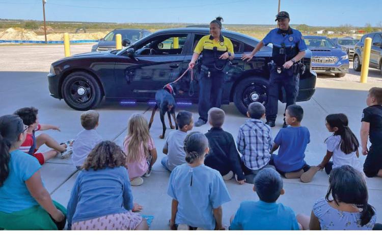 Lometa Police Chief Melissa Cantu and Police Officer Kenny Murray speak to Lometa fourthgraders during Career Day. mason hines | dispatch record