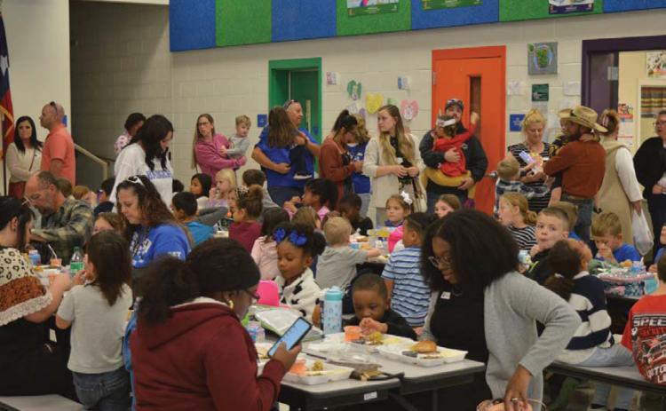 Hundreds of family members visited their students at Taylor Creek Elementary School for Friday’s Thanksgiving feast during lunchtime. erick mitchell | dispatch record
