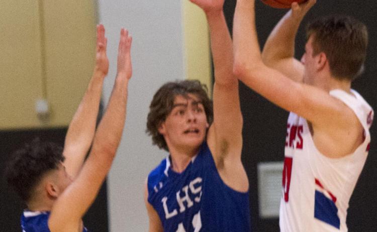 Landon Mulcahy (12) and Anthony Ortiz (1) defend the perimeter on Tuesday. The Badgers did not allow a single three-pointer by Graham in the 77-68 bi-district victory in Brownwood. JEFF LOWE | DISPATCH RECORD