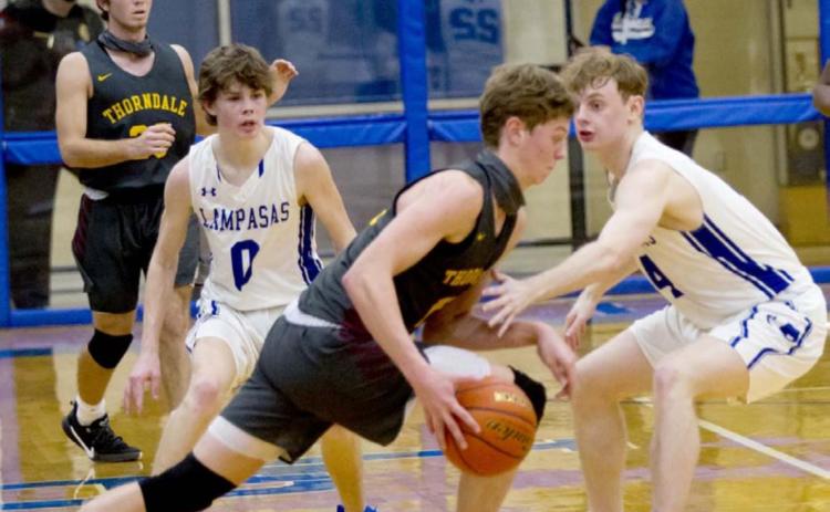 Nate Borchardt (0) and Quinn Pace (4) defend against Thorndale. Borchardt averaged 23 points per game heading into Thursday’s game at Hamilton. JEFF LOWE | DISPATCH RECORD