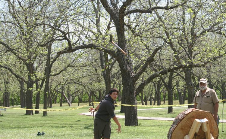Luke Coonrod, 16, from Troop 200 in Lampasas, throws a tomahawk during the San Saba Mountain Man Campout. | Photo by Sherryl-Lynn Gooch
