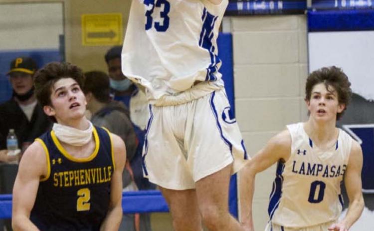Carter Johnson (33) recovers the ball after blocking a three-pointer in the fourth quarter, while Nate Borchardt (0) goes in transition. JEFF LOWE | DISPATCH RECORD