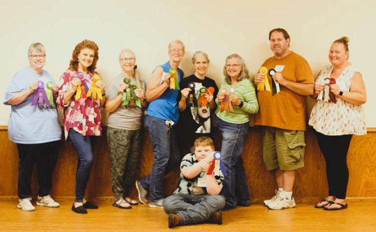courtesy photo Pictured are winners from the recent Browning Community Garden Club’s annual Flower Show. Standing from left to right are Paula Boales-Pabis, Betty Secrest, Gail Eltgroth, Donna Calloway, Ann Laver, Michelle Potter, Daniel Logue and Anelicia Cheney-Campbell; seated in front is Colin Highley.