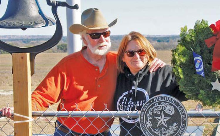 Greg Smith and Tish Casbeer stand behind the newly installed Historical Texas Cemetery medallion that honors Smith Cemetery at School Creek. Smith is the great-great-grandson of Philip Smith who initiated the cemetery in 1854. courtesy photo