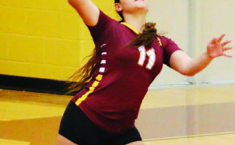 Jasmine Gama serves the ball during the Lady Hornets’ victory last Saturday. MASON HINES | DISPATCH RECORD