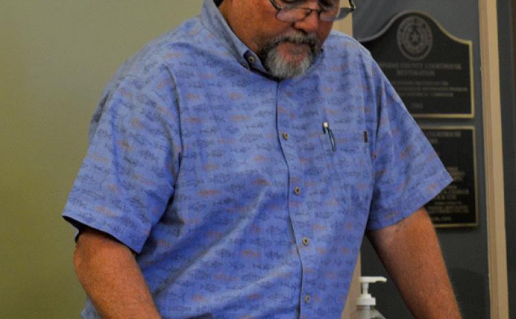Hill Country 100 Club Director Jim Lindeman highlights the organization’s efforts in a presentation during last week’s Lampasas County Commissioners Court meeting. erick mitchell | dispatch record