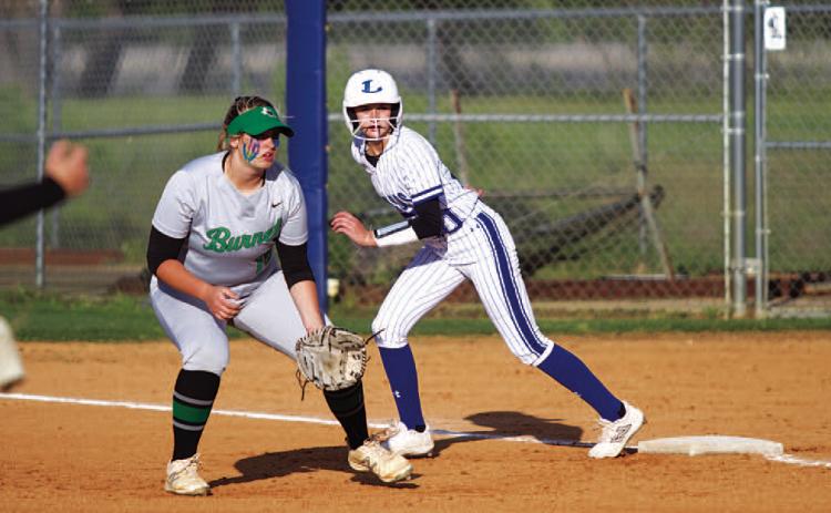Saegan Plouff gets a lead off first base during the Lady Badgers’ win over Burnet on Wednesday. HUNTER KING | DISPATCH RECORD
