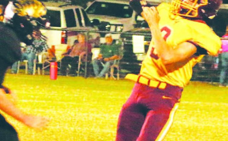 Jordan Livesay attempts a pass while avoiding the rush against Jonesboro. MASON HINES | DISPATCH RECORD