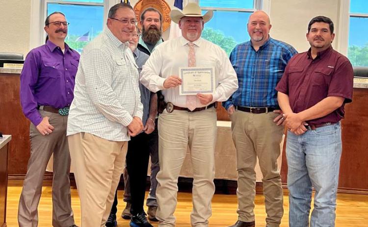 At the March 25 Lampasas City Council meeting, council members recognized Lampasas Police Sgt. Investigator Tim Ryan for his 30 years of service with the department. He is pictured here with Mayor Herb Pearce and members of the council. COURTESY PHOTO | CITY OF LAMPASAS