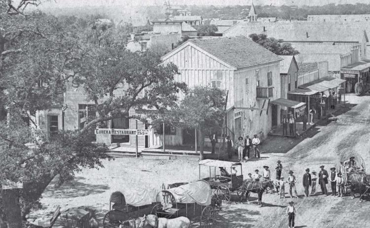 Jerry Scott’s Lampasas Saloon, later the Gem saloon, was located near the north end of the west side of the courthouse square. The “Dead Man’s Saloon” was destroyed by a fire in 1884. The buiding was located behind the tree in this photo. COURTESY PHOTO | lampasas county museum