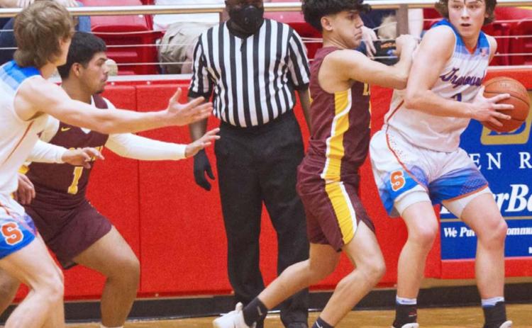 Lometa senior Damion Salinas (1) and sophomore Jeremiah Valenzuela (second from right) defend against Slidell in Tuesday’s fourth-round playoff game at Glen Rose. JEFF LOWE | DISPATCH RECORD