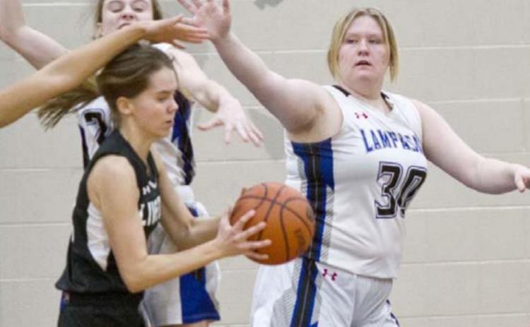 Kyliegh Ball (30) defends the lane against the Lady Falcons on Tuesday. JEFF LOWE | DISPATCH RECORD