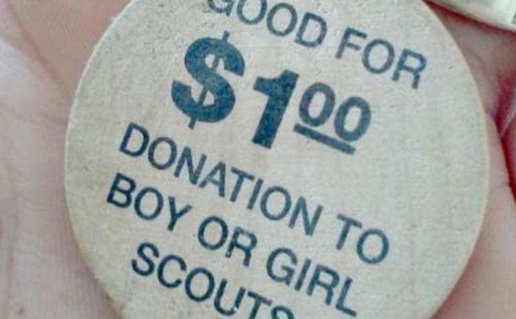 Gina Garner found 672 wooden tokens redeemable for a donation from the Hoffpauir Auto Group to the Boy Scouts or Girl Scouts. COURTESY PHOTO