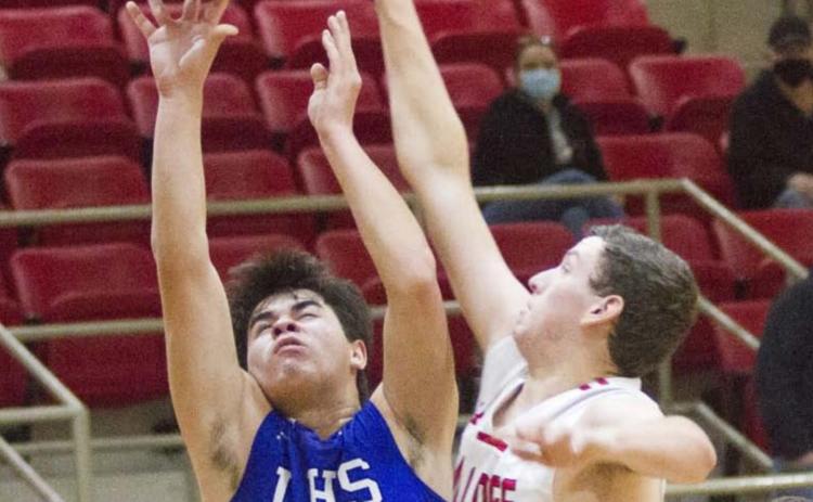 Tak Stinnett (shown shooting in a previous game) and Nate Borchardt (not pictured) had the Badgers’ only three-pointers in a district-opener victory with mostly two-point baskets. JEFF LOWE | DISPATCH RECORD