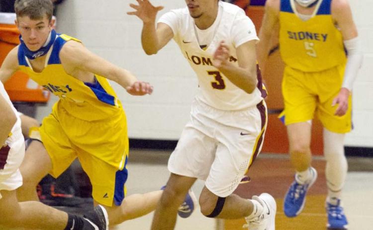 Alonso Caso (3) passes the ball on a fast break in the Lometa Hornets’ bi-district victory over Sidney on Saturday. JEFF LOWE | DISPATCH RECORD