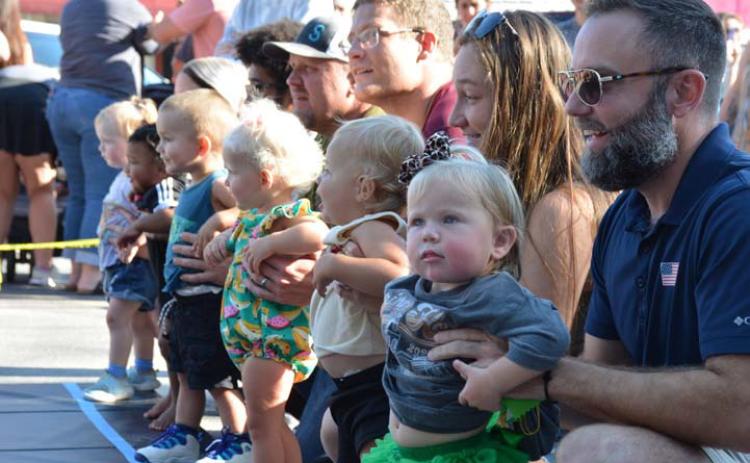 ALEXANDRIA RANDOLPH | DISPATCH RECORD Toddler handlers line up their 16- to 19-month-old race contestants during the annual Spring Ho Diaper Derby on Friday. Results can be found below.