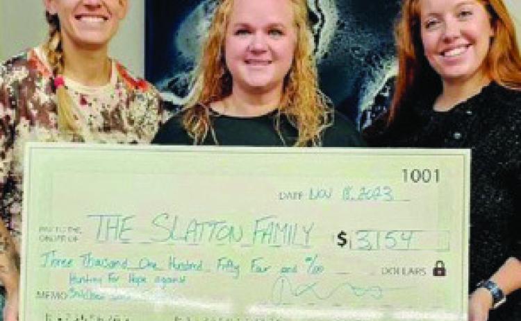 COURTESY PHOTO Folded Owl founder Lacey Schwab, at right, stands alongside Amber Slatton, who received donations from the Hunting4Hope event last year to help her son Cole battle cancer.