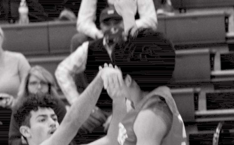 Anthony Ortiz, left, makes one of the seven three-pointers that Lampasas had in the first quarter on Wednesday. JEFF LOWE | DISPATCH RECORD