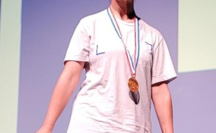 Juliet Cardona displays the medal she received at the UIL State Academic Meet. Cardona took sixth in copy editing. courtesy photo