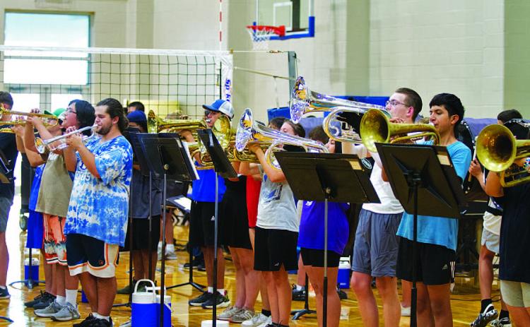 The brass section raises the roof at the final Lampasas High School Badger Band summer rehearsal on Monday evening. HUNTER KING | DISPATCH RECORD