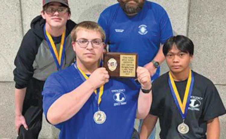 The LHS fire agility team took home silver at the state competition. Pictured, back row, from left, are Tony Carey and instructor Steve Haviland; front row, Joseph Walden and JD Obeda. erick mitchell | dispatch record
