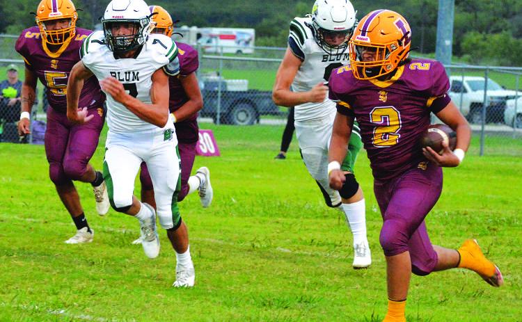 Elijah Gonzales (5) and Matthew Surber (4) are in on a tackle for loss. MASON HINES | DISPATCH RECORD