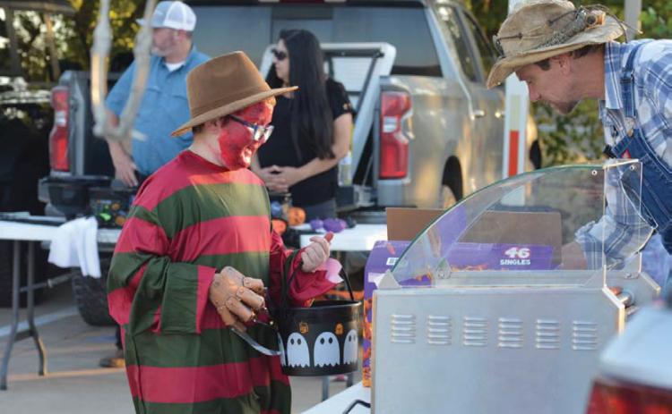 Freddy Kreuger stops by for a hot dog during the city of Kempner’s annual Trunk or Treat event at City Hall. erick mitchell | Dispatch record