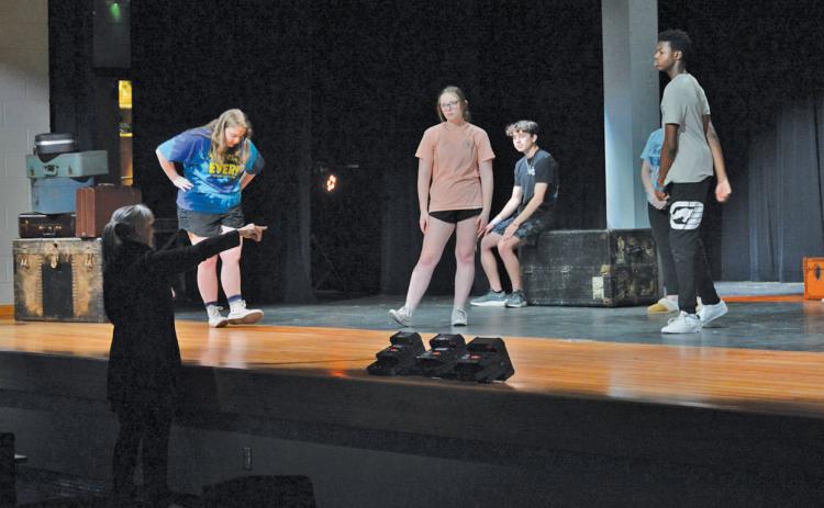 erick mitchell| dispatch record Lampasas High School theater director Greta Peterson leads students through a rehearsal Monday afternoon for their One-Act play titled “The Visit,” by Friedrich Durrenmatt. LHS will compete in the district UIL One-Act Play competition on March 5 at Burnet High School.