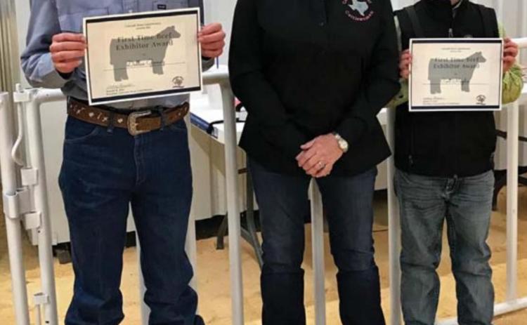 Lampasas County first-time beef exhibitors Dallas Gomez, at left, and Cort Maples are pictured with Janet Machen, Colorado River CattleWomen vice president. COURTESY PHOTO