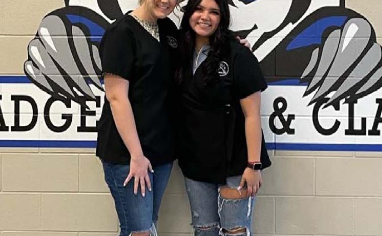 Megan Caddies, left, and Bella Guerra are now licensed cosmetologists after passing their state exams. COURTESY PHOTO