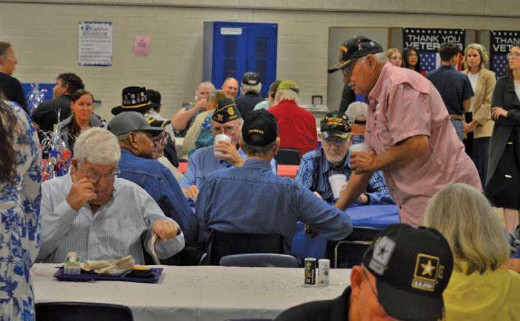 U.S. military veterans share conversations during breakfast served by Lampasas Middle School students before the campus’ 22nd annual Veterans Day ceremony. erick mitchell | dispatch record