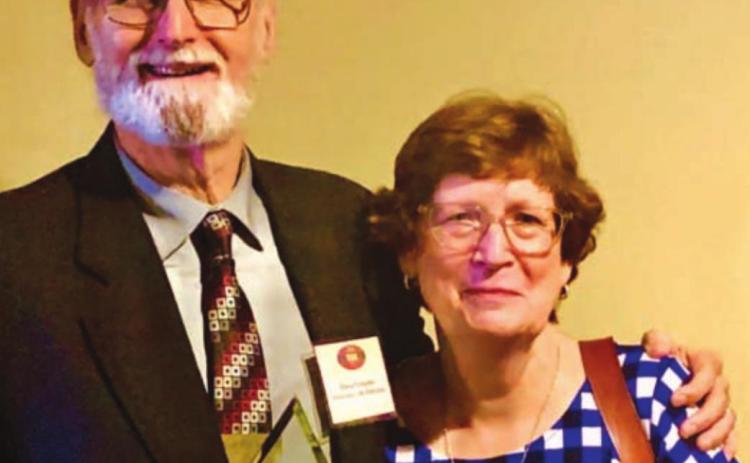 Steve Forsythe, shown with his wife, Cynthia, holds the Ag Education Hero Award he received from the Agriculture Teachers Association of Texas during the group’s annual summer convention. COURTESY PHOTO