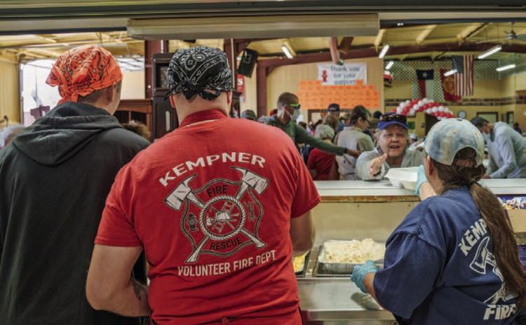 Kempner VFD volunteers Collin Martin, Steven Martin and Norine Martin are pictured left to right serving guests at the Kempner VFD BBQ and Auction in the spring of 2023. FILE PHOTO