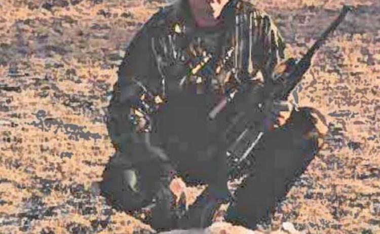 Harold Harton’s son, Hal Harton, is shown with a coyote that wasn’t able to elude the experienced hunter. HAROLD HARTON | COURTESY PHOTO