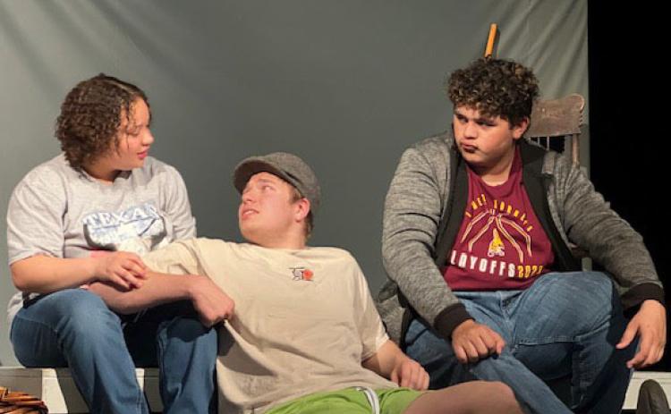 COURTESY PHOTOS Sholee Turner, Jacob Wooten and Lamar Linton, left to right, run lines during a practice on set. Lometa will compete in the district One-Act Play contest on Monday in Lometa.