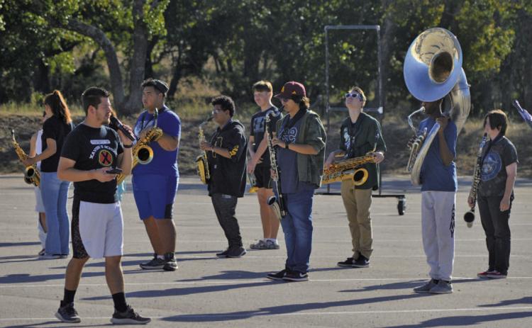 Lampasas High School band director Eduardo Zambrano leads the Badger Band through marching practice earlier this fall. Nineteen LHS band students earned All-Region honors. ERICK MITCHELL | DISPATCH RECORD