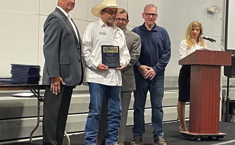 Adamsville Volunteer Fire Department Chief Dean Watson, holding plaque, was named First Responder of the Year for his entity by the Hill Country 100 Club. The club held its banquet March 7 to recognize area first responders. sharon watson | courtesy photo
