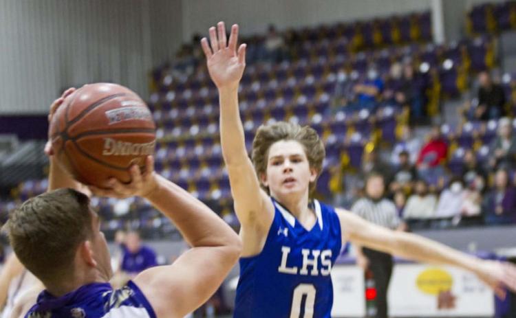 Nate Borchardt (0) defends a shot near the perimeter in the Badgers’ 81-39 victory at San Saba on Monday. JEFF LOWE | DISPATCH RECORD