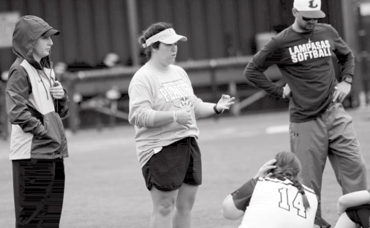 Macey Siegert, far left, is shown with head softball coach Jessica Harborth, assistant coach Logan Simmons, and players after a season-ending loss to Burkburnett. JEFF LOWE | DISPATCH RECORD
