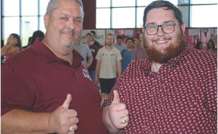 MASON HINES | DISPATCH RECORD John Hines, left, and Mason Hines both received their Aggie rings on April 13.